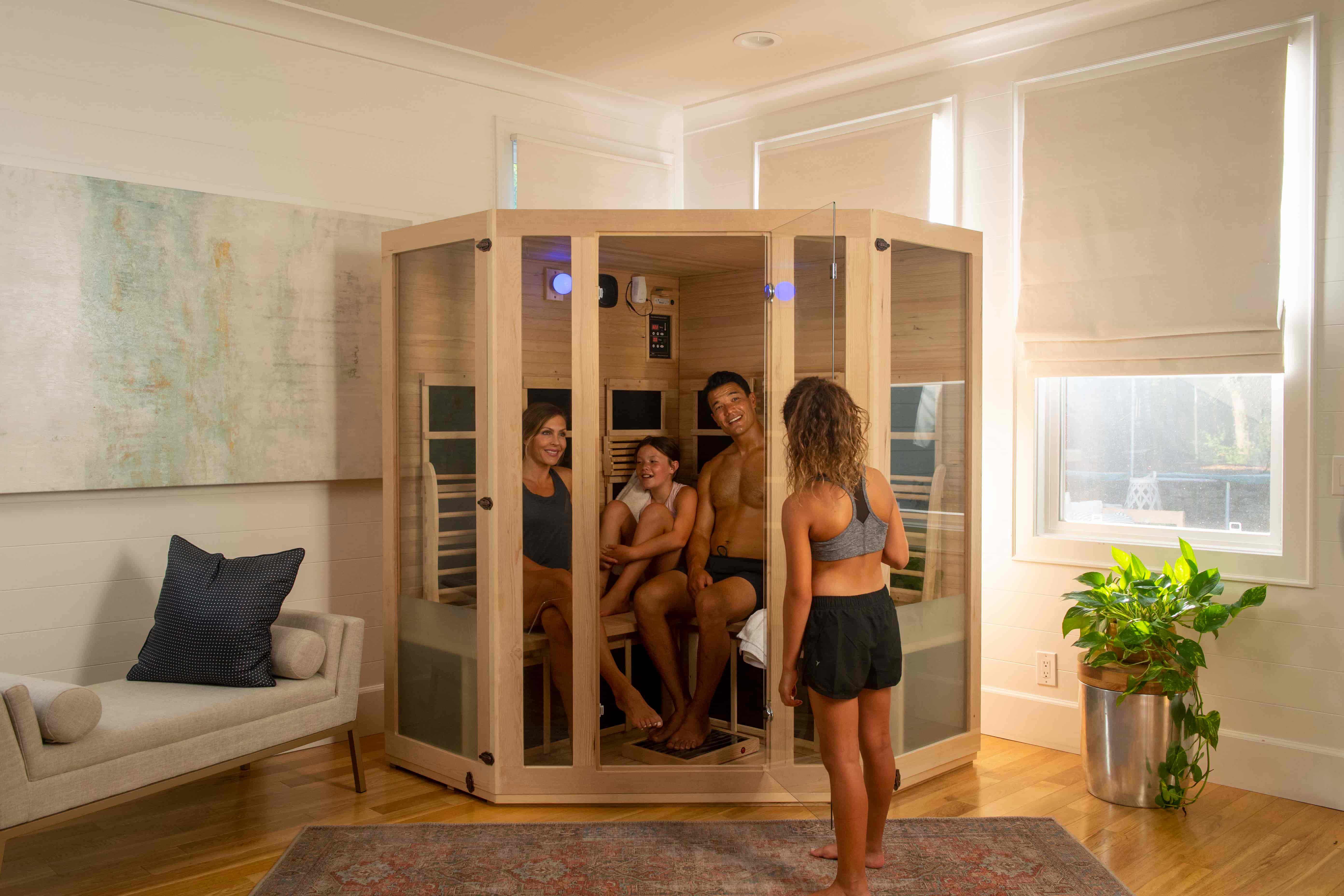 girl about to join her family in a far infrared sauna by JNH Lifestyles