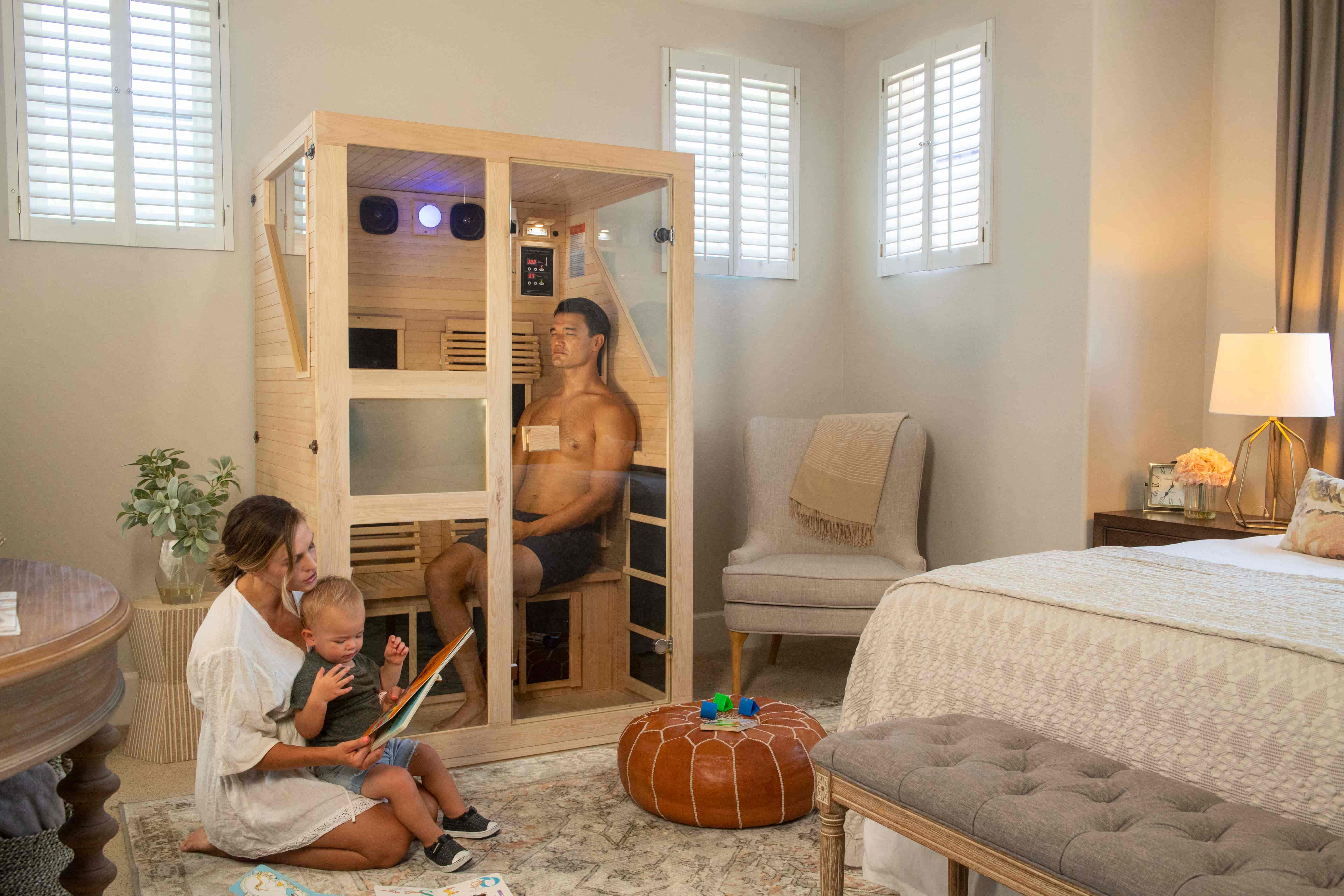 A husband enjoying a far infrared session inside of an ultra low emf infrared sauna by JNH Lifestyles